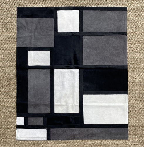 Tapis patchwork style Mondrian noir et blanc - Peau de vache & Cie